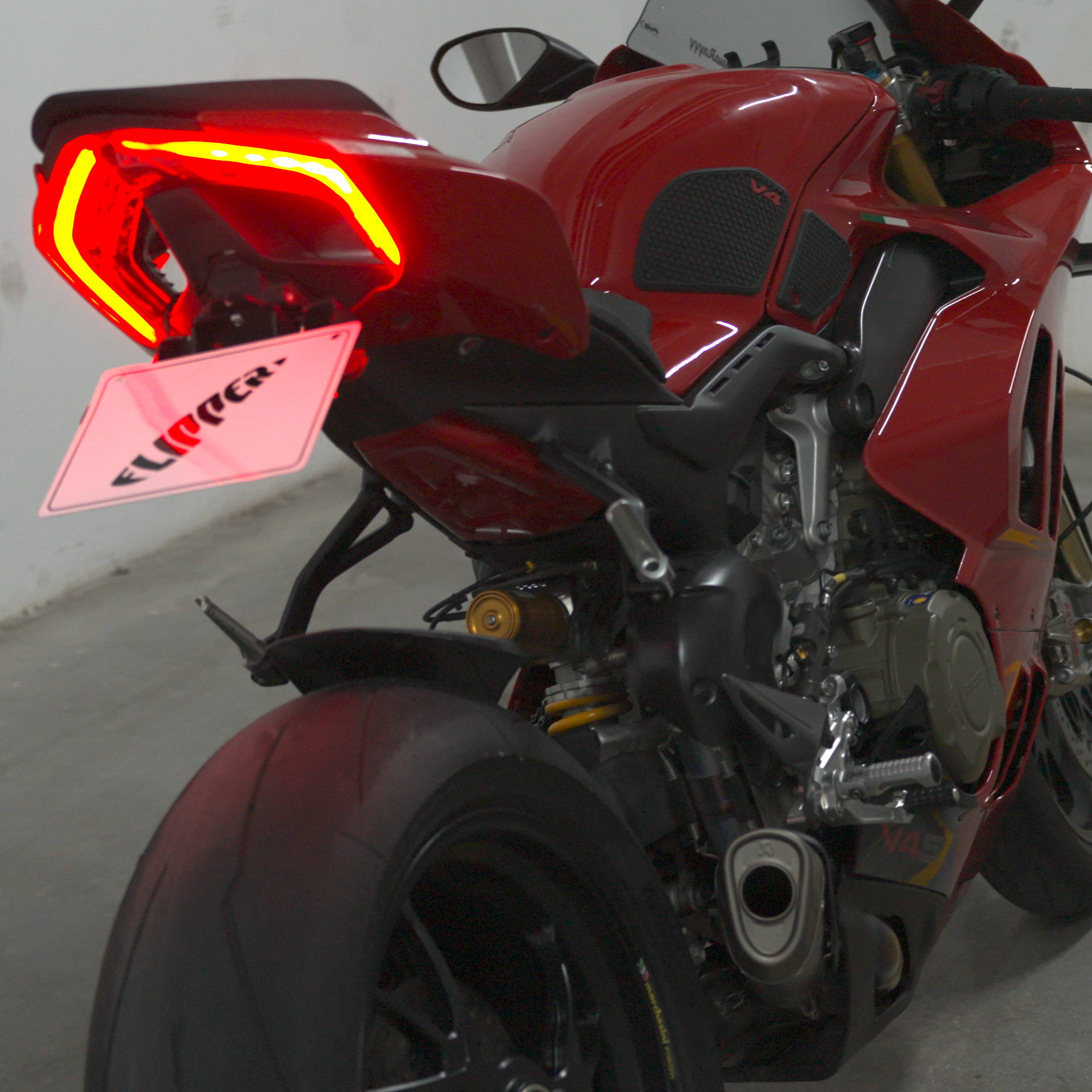 Motorcycle plate flipper on Ducati Panigale V4S