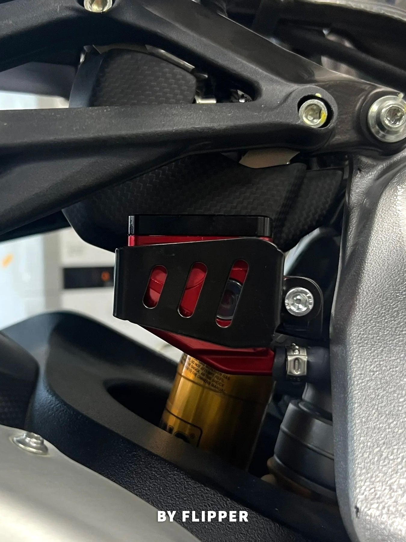 Close-up of a MV Agusta rear reservoir heat guard